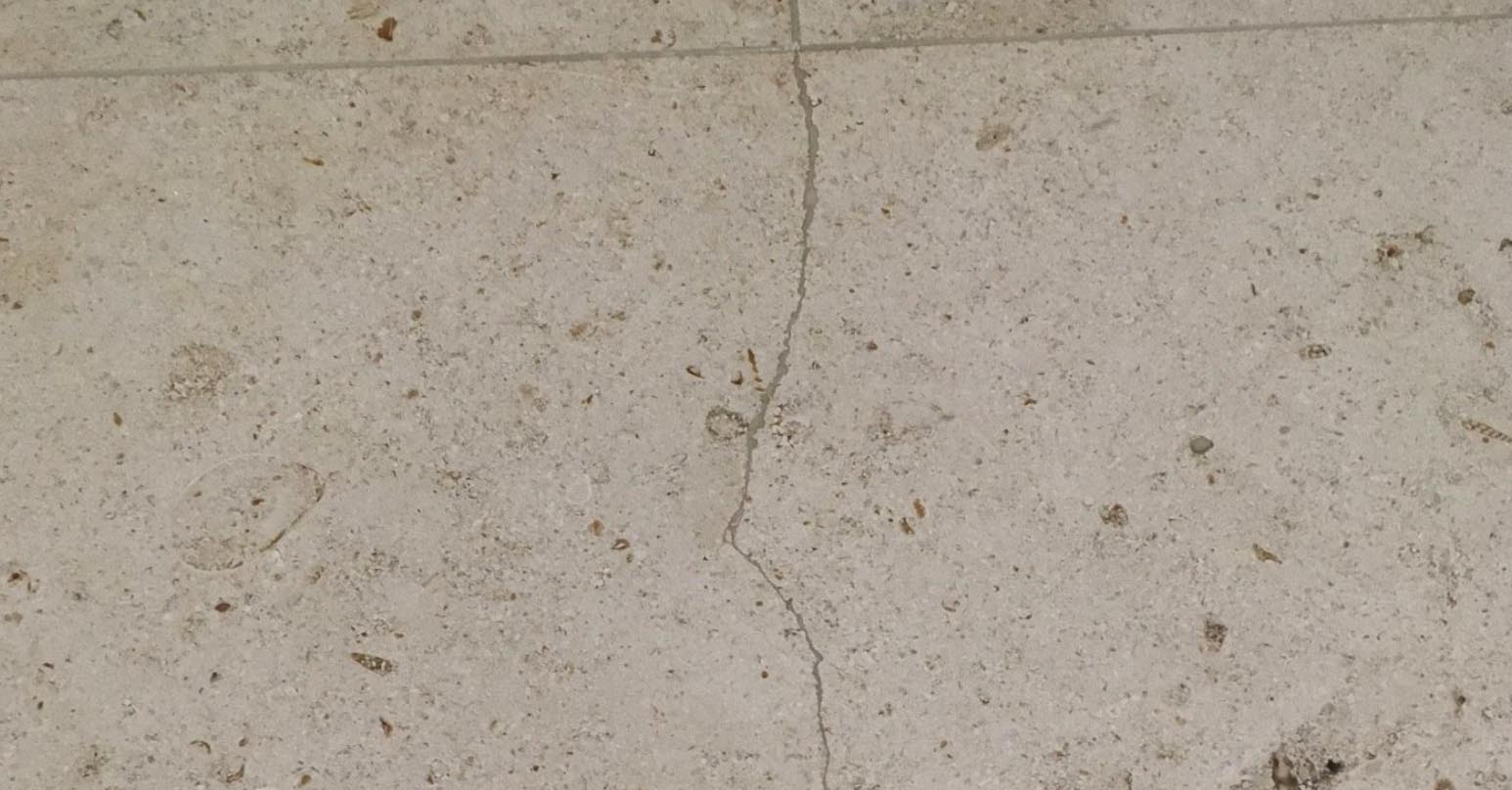 Cracked floor tile - Before repair