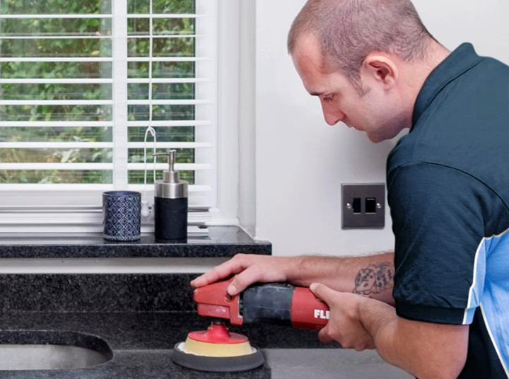 Finisher restoring a kitchen worktop