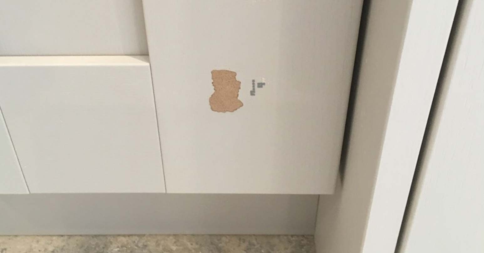 Damaged cupboard door - Before repair