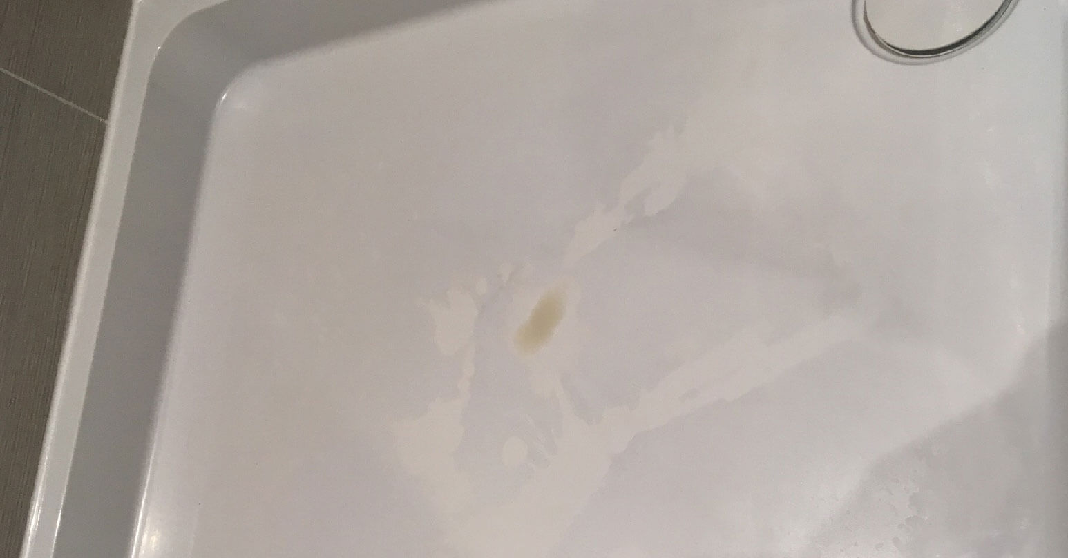 Discoloured shower tray - Before repair