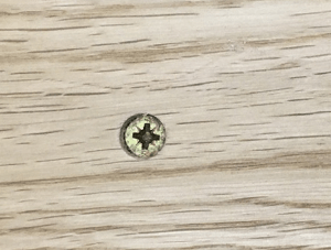 Screw showing in wood flooring