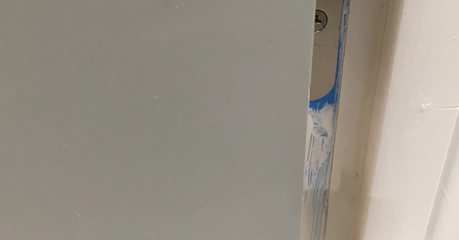Large dent in laminate grey door - After repair