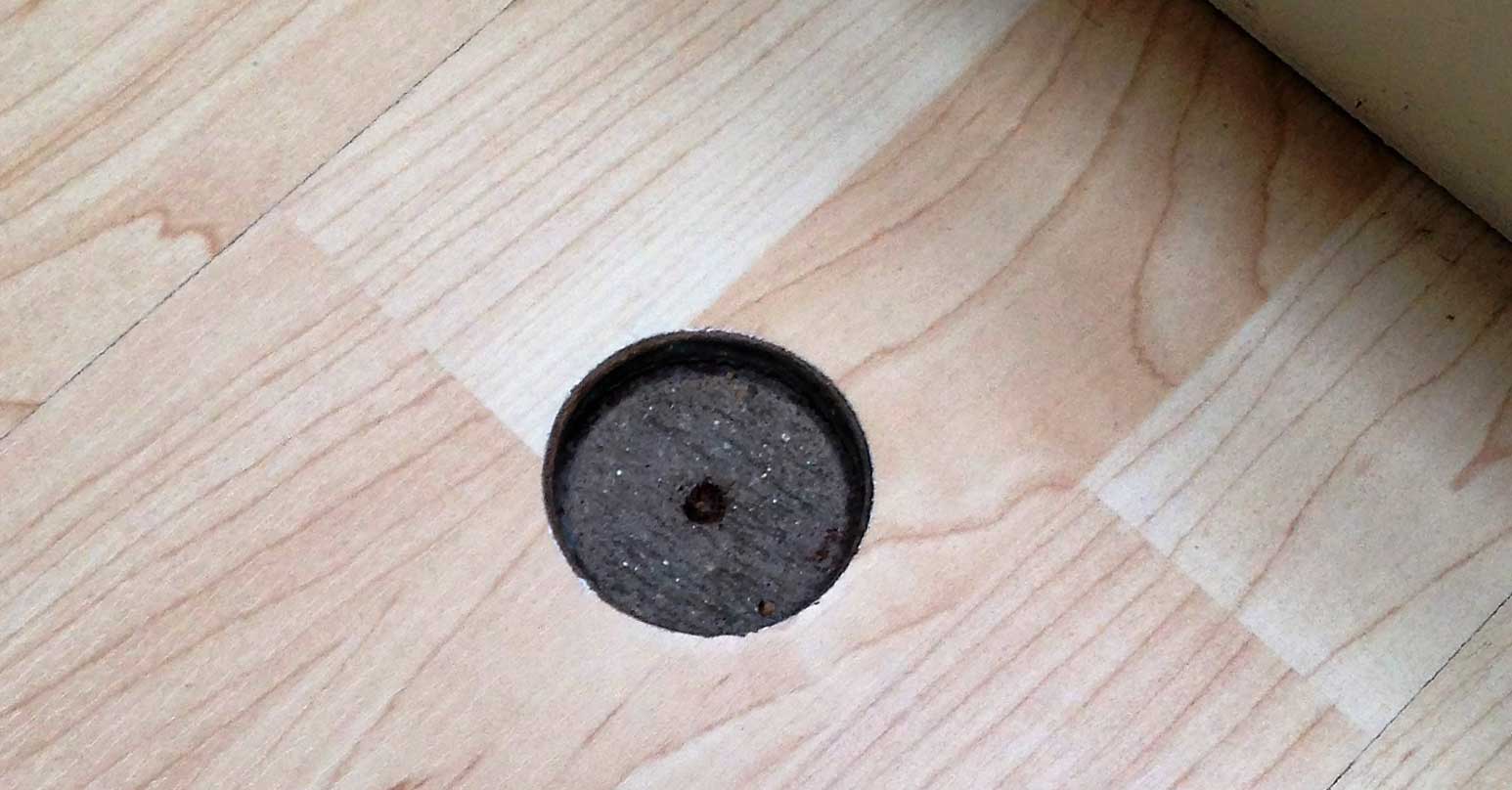 Large hole in wood floor - Before repair