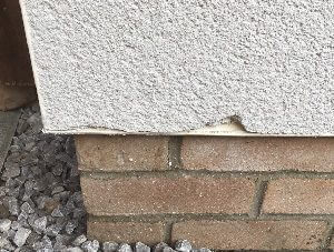 Chipped render wall