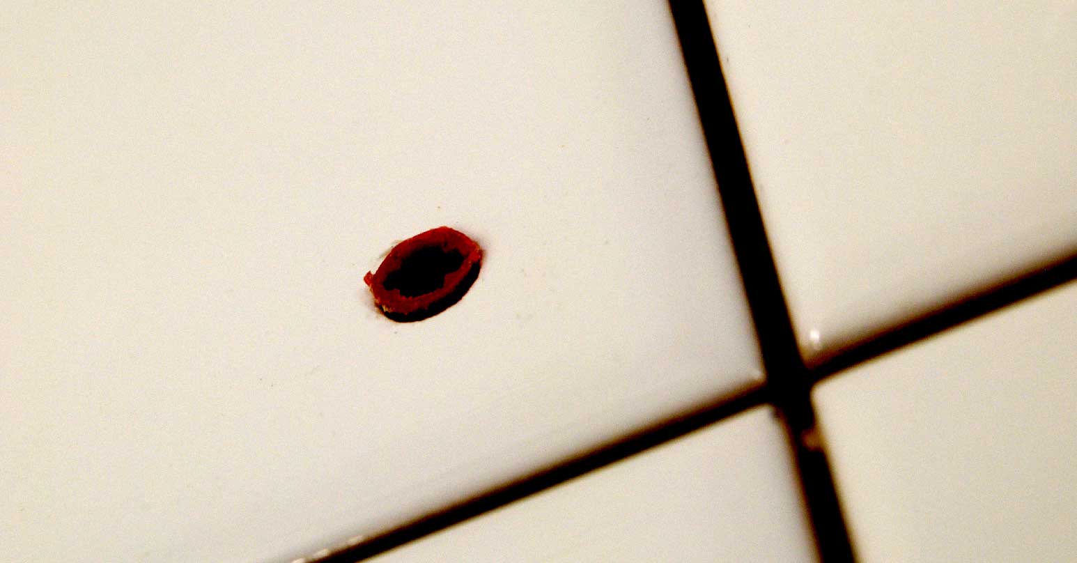 Hole in white tile