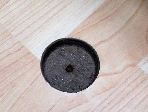 Hole carved into wood flooring, ready for repair