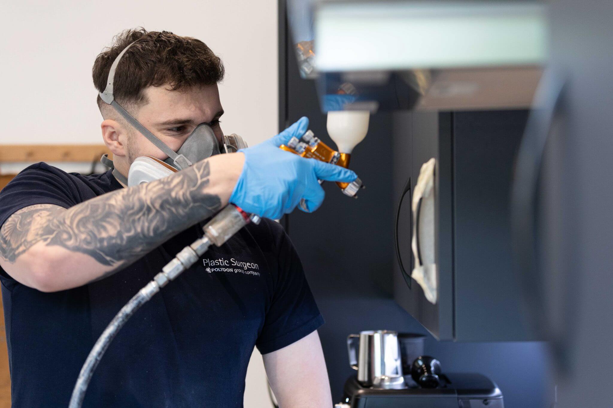 A fine finisher repairing a high gloss kitchen unit